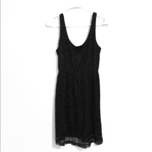 Medium black lace dress, above knee length.